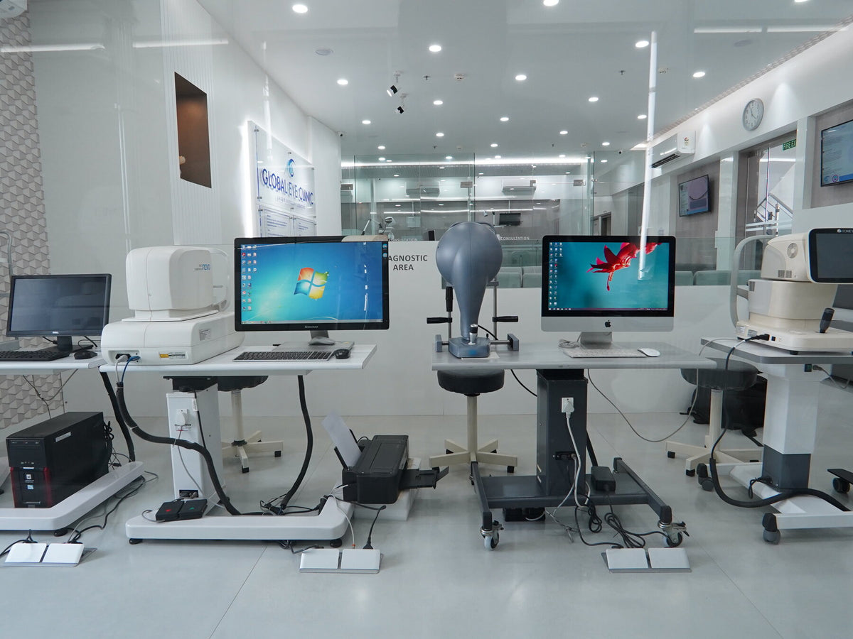 Global Eye Clinic diagnostic area with multiple eye-imaging machines and computer stations