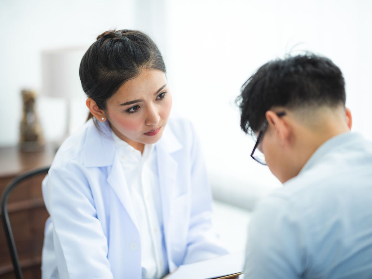 Doctor listening to a patient during a consultation