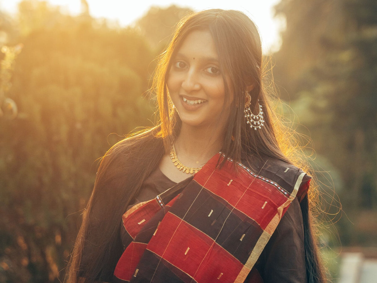 A young woman outdoors in warm evening light