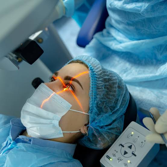 A patient under the surgical microscope during laser treatment